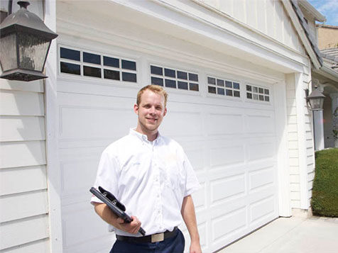 Garage door rollers on a sectional door track